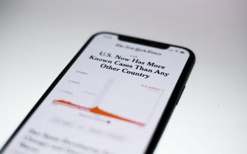 cell phone displaying a story from The New York Times