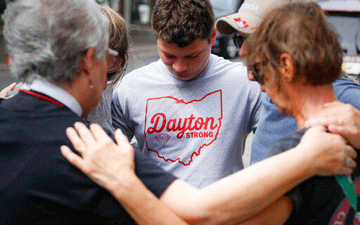 People gathering together after the Dayton, Ohio shooting