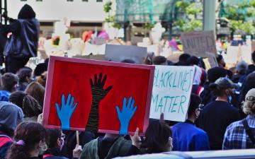 protesters holding signs at a Black Lives Matter protest
