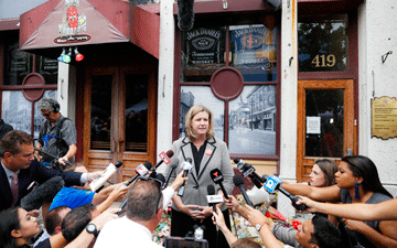 Woman speaking to the press