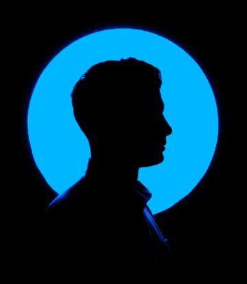 Profile picture silhouetted against a blue and black background