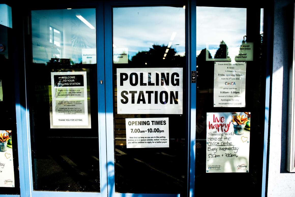 Door for polling station covered with polling related signage