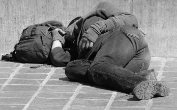 picture of man sleeping on the streets