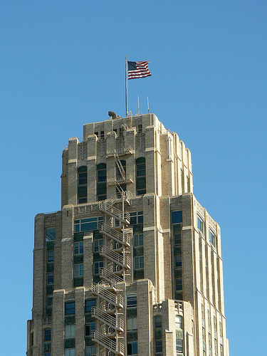 skyscraper with American flag on top