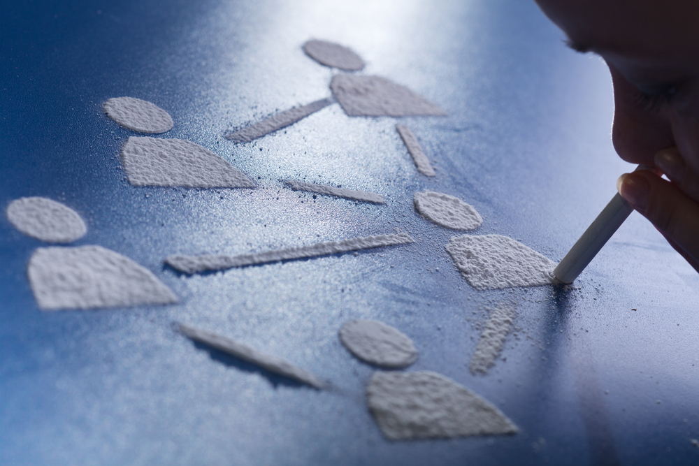 Person snorting white powder image link to story