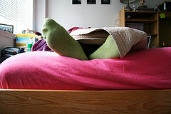 College student lying in bed image link to story