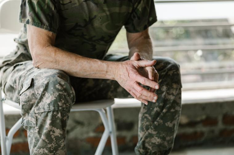 Close-up of a military veterans hands in a therapy session, emphasizing mental health support. RDNE Stock Project via Pexels. 
