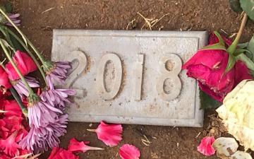 Gravestone for the year 2018 under or nearby which the cremated remains of 1,780 persons who died unclaimed are buried in Evergreen Cemetery in Boyle Heights.  Photo by David DeCosse