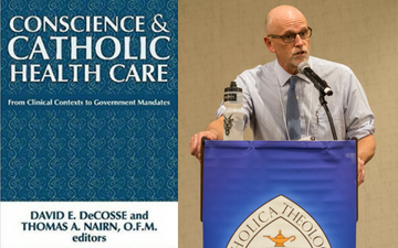 A man speaks at a podium with a banner reading 
