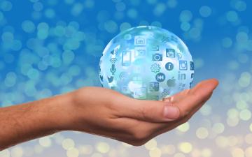 an outstretched hand holding crystal ball with social media and tech app icons