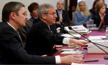 Mankiw, on the left, sits as chairman of The Council of Economic Advisors at a hearing regarding President Bush’s 2005 financial budget