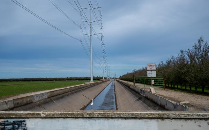 Power lines and water canal at Concentrated Animal Feeding Operation. Photograph by Andrew Schatz. 