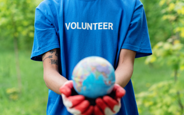 A person wearing a t-shirt that says 