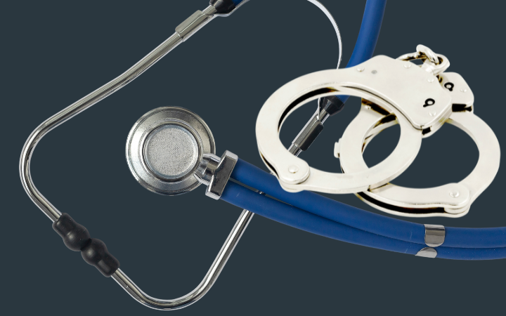 An arial view of a metal stethoscope and pair of metal handcuffs. Image created with Canva Enterprise.