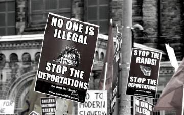 Immigration protest signs saying 