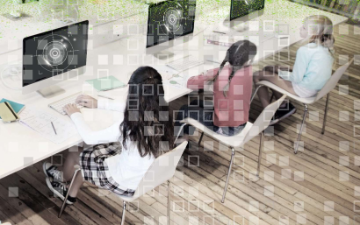 Kids at computers with numbers overlaid on the image.