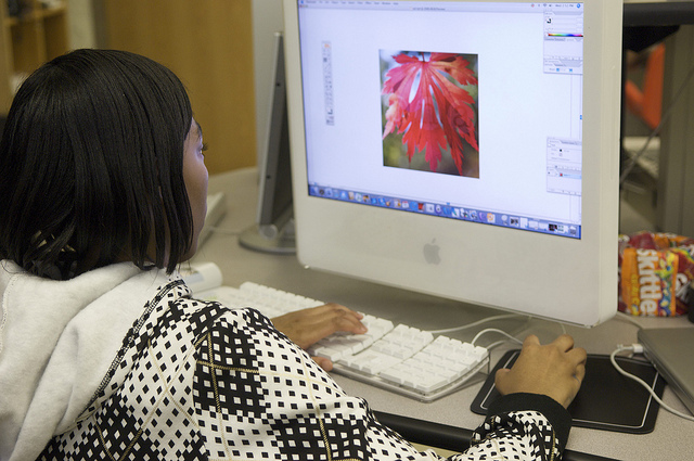 Student facing computer screen and keyboard