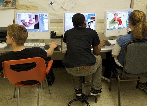 students facing computer screens
