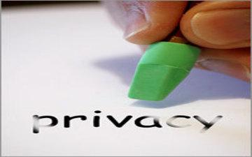 A hand using a green eraser on the word privacy. image link to story