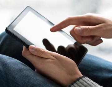 Hands on tablet