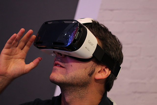 man looking through VR headset