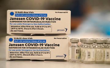 Boxes labeled Janssen COVID-19 Vaccine with English and French text. image link to story