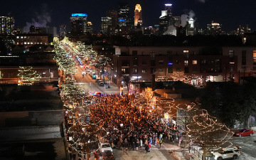 People gather during a vigil where Alex Pretti was shot and killed by federal immigration enforcement in Minneapolis, on Wednesday, Jan. 28, 2026. (AP Photo/Adam Gray)