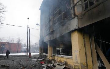 A burned building with smoke, destroyed from war. image link to story
