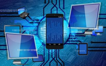 Smartphone connected to two tablets with a digital binary code background. image link to story