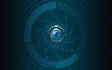 Abstract camera lens graphic with blue and black tones. image link to story