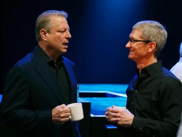 Al Gore and Tim Cook at Apple's Worldwide Developers Conference 2013 (AP Photo/Eric Risberg). image link to story