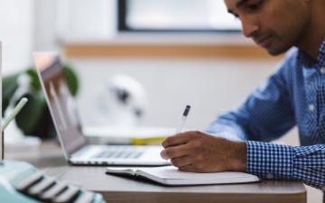 man in front of laptop