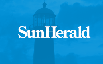 SunHerald text with a lighthouse silhouette on a blue background. image link to story