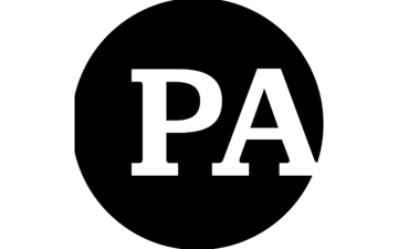 Black circle with letters P and A in white lettering. image link to story