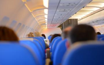 passengers seated on an airplane image link to story
