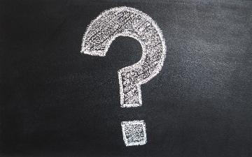 Chalk-drawn question mark on a blackboard. image link to story