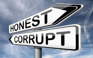 Street signs reading HONEST and CORRUPT pointing in opposite directions.