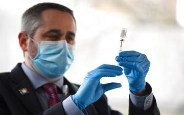 The Associated Press Hartford Healthcare Director of Pharmacy Eric Arlia prepares the Pfizer BioNTech COVID 19 Vaccine to be administered to frontline healthcare workers at Hartford Hospita Monday Dec 14 2020 in Hartford Conn AP PhotoJessica Hill image link to story