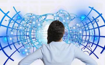 A person stands in front of a digital network. Text: Its Time to Talk About Responsible Tech. image link to story