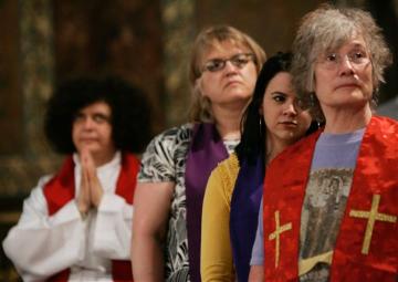 Members of the Womens Ordination Conference attend a mass at the Anglican church Rome, Wednesday, June 9, 2010. Groups that have long demanded that women be ordained Roman Catholic priests took advantage of the Vaticans crisis over clerical sex abuse to press their cause demanding the Vatican open discussions on letting women join the priesthood. (AP Photo/Riccardo De Luca)