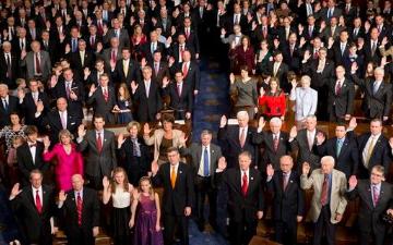 A large group of people in formal attire.