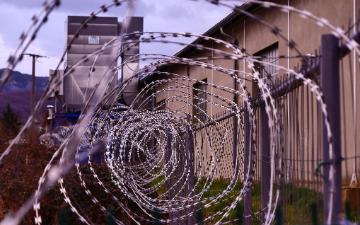 barbwire fence in front of a building