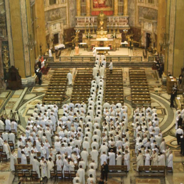 A Jesuit congregation gathered in a large ornate church.