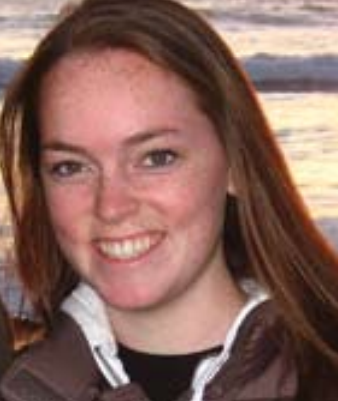 A smiling person in a jacket.