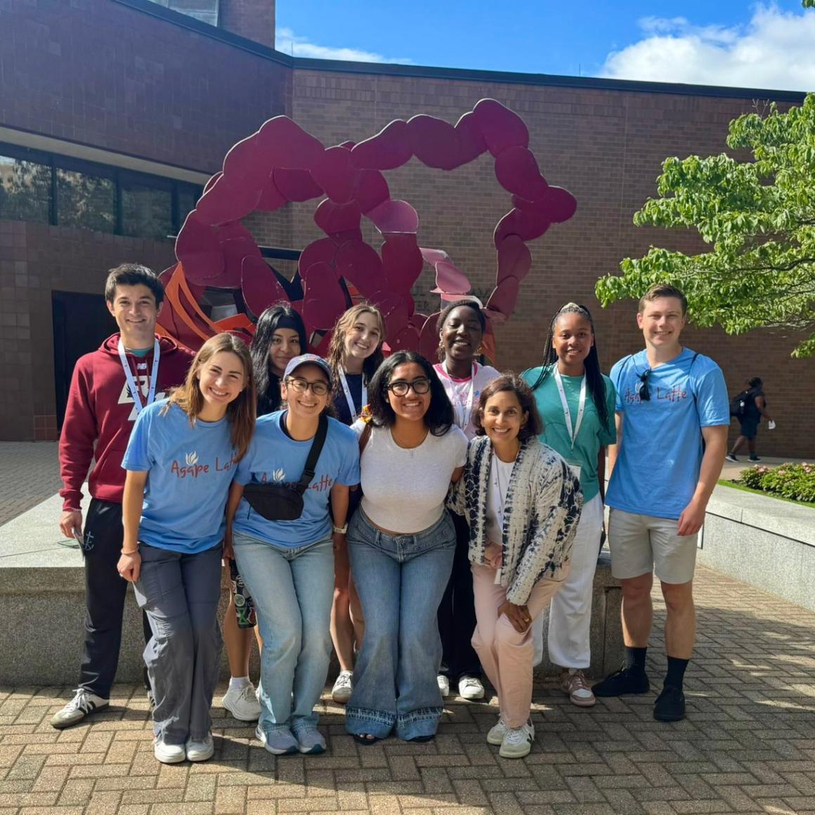 AMDG students 2025-26 in front of red modern art structure BC 