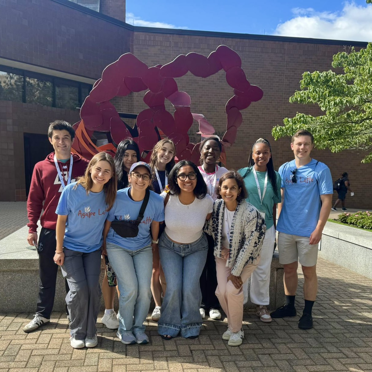 AMDG students 2025-26 in front of red modern art structure BC