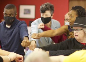College of Adaptive Arts Fist Bump