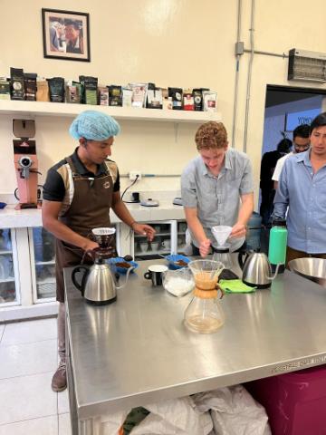 Christopher Lane learning to make drip coffee