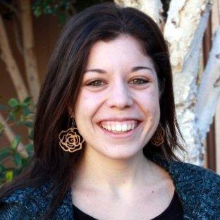 A person smiling outdoors named Kelly.