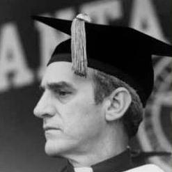Person in graduation cap and gown.